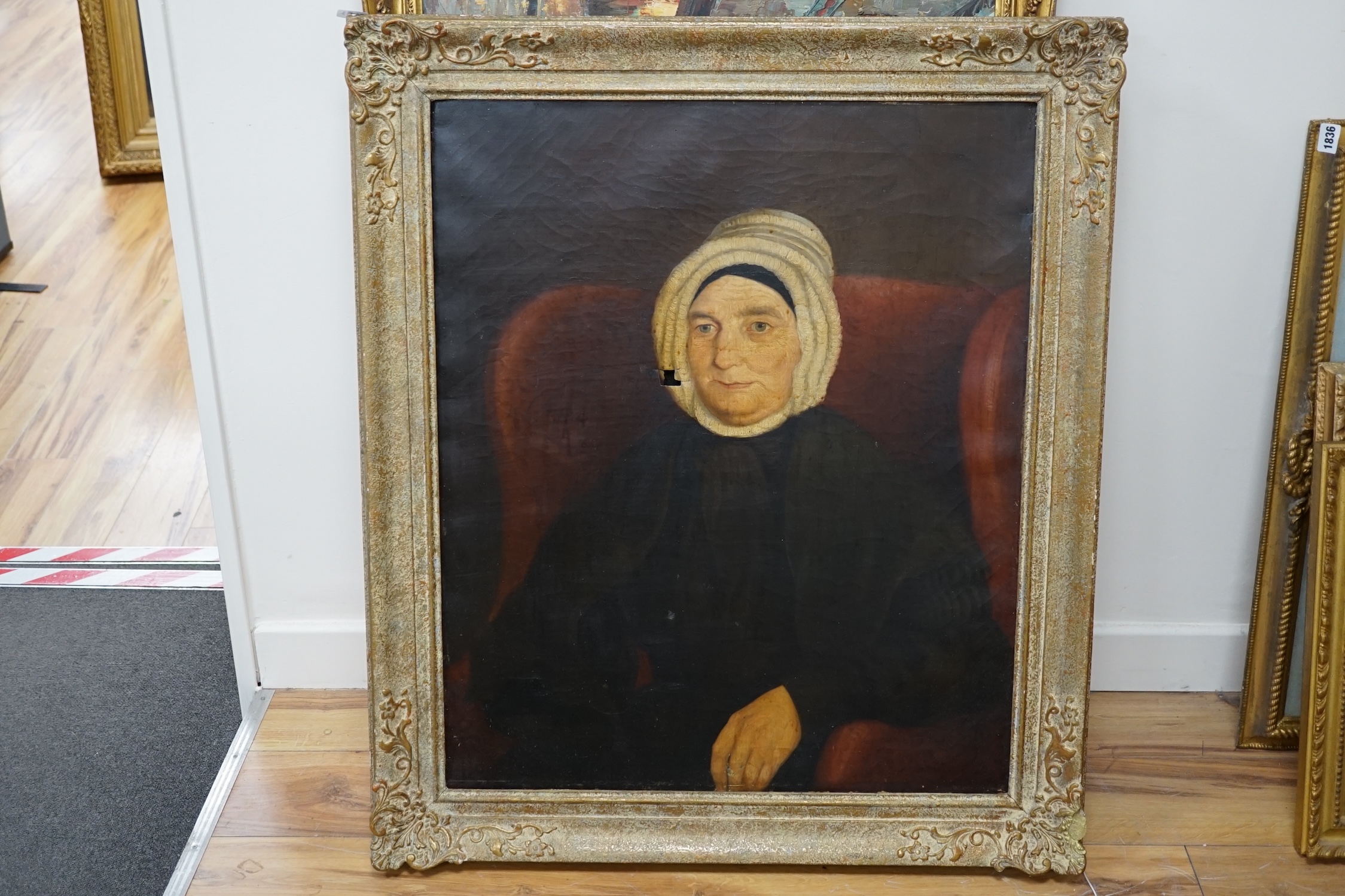 Early 19th century, English School, oil on canvas, Portrait of an elderly woman wearing a bonnet, 75 x 62cm. Condition - poor, hole in canvas